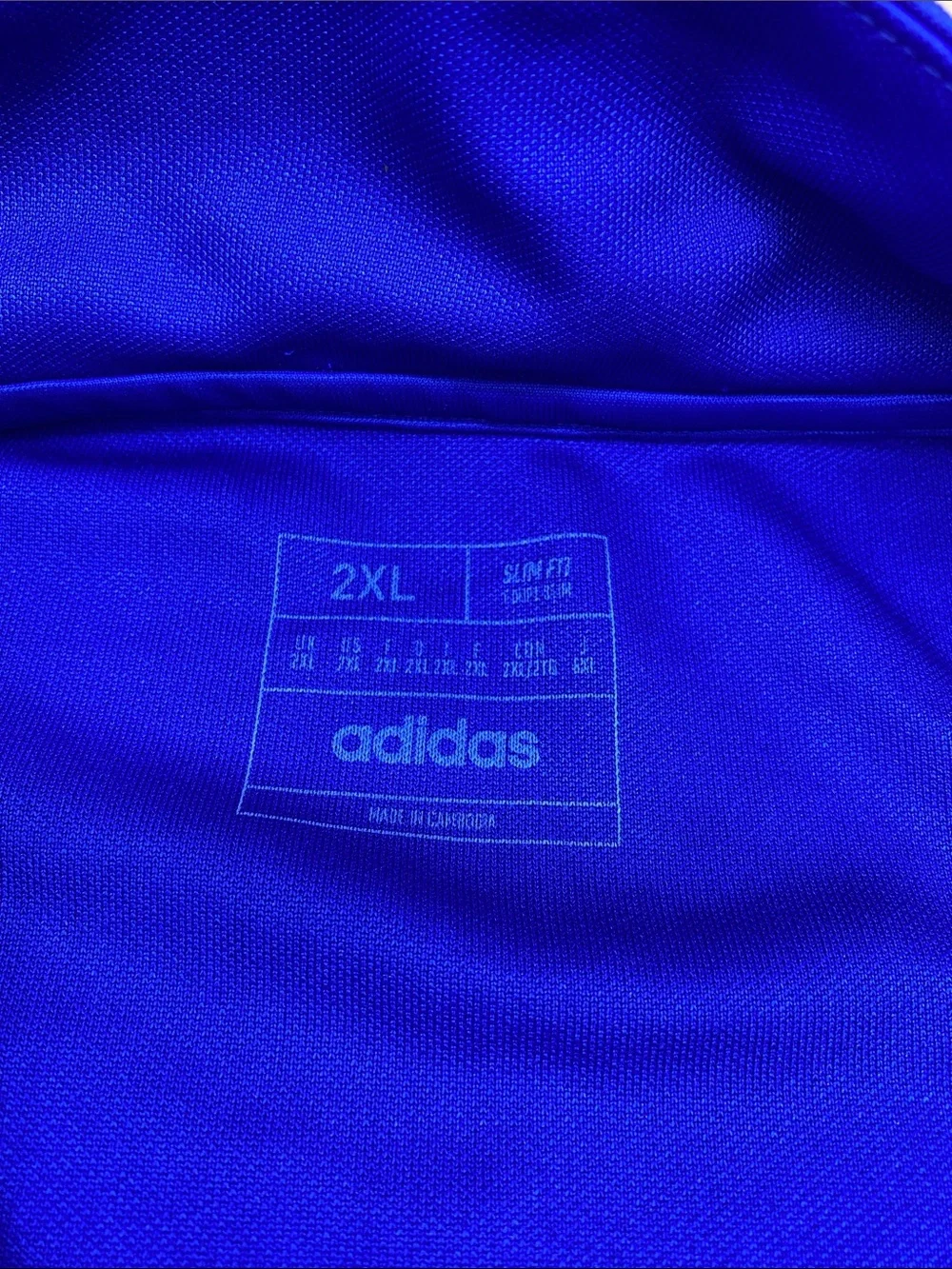 adidas Men’s Royal Blue Half-Zip Track Top with Orange Accents